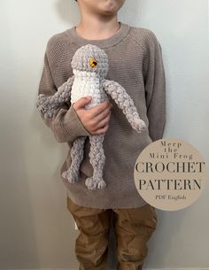 a young boy holding a stuffed animal in front of a white wall with the words keep it mum for crochet pattern