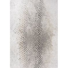 a white and grey rug with an animal print on it