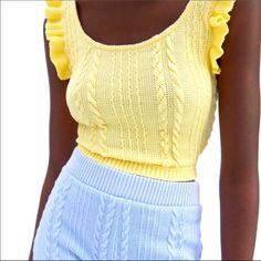 Nwt Zara Yellow Ruffled Cable Knit Top -Sleeveless Round Neck Top -Knit Woven Pattern On Front And Back -Crop Top With Ruffle Trim -Soft Feel Fabric -Materials: 99% Polyester, 1% Elastane -Size: Large -Color: Yellow -Measurements: **Please Also See Photos For Best Accuracy -Items Come From A Smoke Free And Pet Free (Unfortunately) Home -Please See My Other Matching Items For Combined Shipping And Savings !! Sleeveless Knit Top With Ruffles, Yellow Sleeveless Sweater Vest For Spring, Sleeveless Cable Knit Summer Tops, Sleeveless Cable Knit Tops For Summer, Chic Sleeveless Cable Knit Top, Spring Chic Knitted Tank Top, Trendy Yellow Knit Top, Chic Knitted Tank Top For Spring, Spring Fitted Knitted Sweater Vest