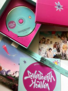 the cd is in its pink box and it's next to some other items