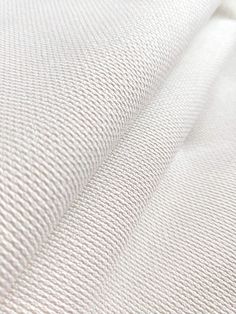 white fabric textured up close to the camera