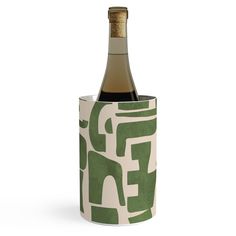 a bottle of wine in a green and white paper holder with the word eff on it