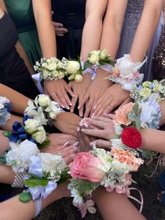 a group of people with their hands together