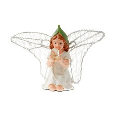 a small angel figurine holding a bowl of food in it's hands