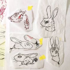 several drawings of rabbits and other animals on paper