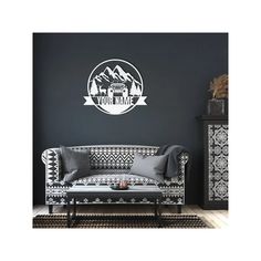 a black and white living room with a quote on the wall that says believe in the magic