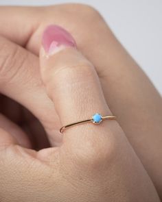 "This Turquoise Ring is the perfect addition to your minimalist jewelry collection. Our solitaire ring is meant to be classic enough for everyday wear or to give as a bridesmaid gift. This stacking ring will deﬁnitely be a favorite of yours! ** PLEASE NOTE: The model is wearing multiple rings. This listing is for Turquoise Ring ** At LunaiJewelry, we take pride in the details and love we pour into everything we make. We know you'll find something lovely for yourself or to give as a gift to someo Elegant Turquoise Ring For Anniversary With Round Band, Elegant Turquoise Ring With Round Band For Anniversary, Elegant Turquoise Ring For Anniversary, Elegant Stackable Turquoise Open Ring, Turquoise Round Band Promise Ring, Elegant Stackable Open Turquoise Ring, Dainty Adjustable Turquoise Promise Ring, Minimalist Stackable Turquoise Ring For Anniversary, Elegant Stackable Turquoise Ring