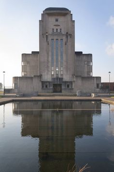 a large building sitting next to a body of water