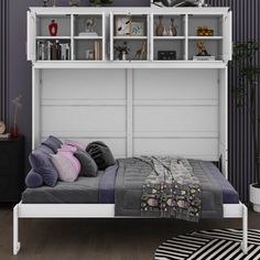 a bedroom with purple walls and white shelves above the bed, along with a striped rug on the floor