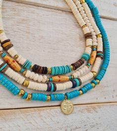 "🚨 if the colour you'd like is out of stock please let me know and  if I have the beads I will make one for you 😉  Boho Necklaces made with Turquoise, Cream and Wooden Heishi Beads with Golden Spacers and a Hook to Fasten.  Choose from:  1. Turquoise with Golden Snake Pendant  2. Cream Howlite Rondelles with Wooden Barrel Beads 3. Cream Heishi Beads with Wooden and Turquoise  4. Cream Heishi Beads with Turquoise Centre    All Lengths: 16\" (approx) Beads: 8mm 👉Follow me @Bohoseason  on Facebo Boho Necklace Diy, Golden Snake, Beaded Boho Necklace, Micro Mosaic Jewelry, Boho Necklaces, Heishi Necklace, Wooden Barrel, Snake Pendant, Southwest Jewelry