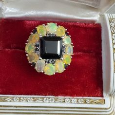 Huge Opal Ring! Size 7. Stamped 925 Sterling Silver. New Old Stock. Genuine Opals With Lots Of Flash! Black Stones Test As Black Tourmaline. Ring Box For Display Only. See All Pics For More Info! Amazing! See My Other Listings For Sterling Silver, Solid 10k, 10kt, 417 , 585, Solid 14k, 14kt Solid 18k, 18kt, Diamonds, Sapphire, Emerald, Garnet, Jade, Amethyst, Citrine, Ruby, Topaz, Other Precious Stones And Other Jewelry Key Words: Kay's, Jared, Zales, Engagement, Anniversary, Birthday Black Opal Stone, Opal Color, Black Tourmaline, Black Stone, Black Opal, Opal Rings, Womens Jewelry Rings, Citrine, Precious Stones