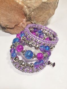 Memory wire bracelet fits all sizes. Easy to wrap around your wrist, just takes seconds. 7 strands of Purple, hot pink beads Glass and metallic beads. One of a kind, no duplicates. Bohemian Purple Multi-strand Beaded Bracelets, Purple Memory Wire Bracelets, Purple Bohemian Multi-strand Beads, Bohemian Nickel-free Purple Bracelets, Shasta Lake, Purple Bohemian Hand-strung Beads, Memory Wire Bracelet, Purple Lavender, Memory Wire Bracelets