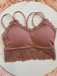 Lace Trim Bralette - Works for an everyday bra, or if you're wearing an off the shoulder top and going for a fun look! Comes in White, Tan & Mauve One-Size - Removable Padding Inserts Pink Top With Removable Bra Pads For Spring, Pink Tops With Removable Bra Pads For Spring, Spring Stretch Bra With Adjustable Straps, Seamless Cami Bra For Spring, Spring Seamless Cami Bra, Stretch Sports Bra With Removable Pads For Spring, Spring Cami Bra With Removable Pads, Strapless Bra With Removable Pads For Spring, Spring Bandeau Camisole With Built-in Bra