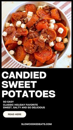 a bowl filled with carrots and nuts on top of a table