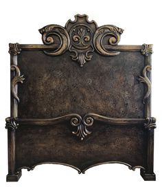 the headboard is made from metal and has ornate carvings on it