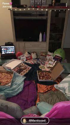 the pizzas are on the bed and ready to be eaten by someone else in the living room