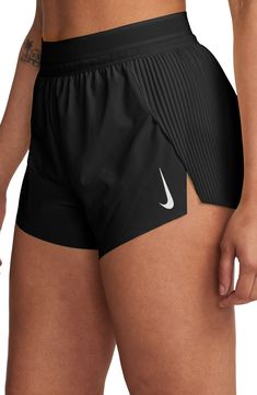 These mid-rise running shorts offer moisture-wicking comfort and side slits to keep you moving with comfort and confidence. 3" inseam; 23" leg opening; 12 1/2" front rise; 15" back rise (size Medium) Elastic waist with internal drawcord Three internal drop-in pockets Dri-FIT moisture-wicking technology Stretch lining 86% polyester, 14% spandex Machine wash, tumble dry Imported Nike Running Shorts Athleisure Style, Running Attire Women, Sporty Nike Shorts, Nike Stretch Shorts For Running Errands, Nike Stretch Shorts For Casual Wear, Nike Short Leg Activewear For Running, Nike Athletic Shorts For Running, Nike Athleisure Athletic Shorts For Running, Nike Athletic Running Shorts