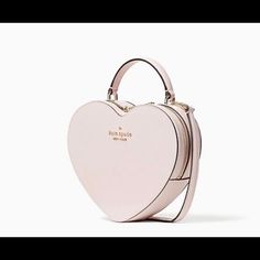 Brand New Love Shack Heart Purse From Kate Spade. Must Have In Your Collection. Details 7.48"H X 8.27"W X 2.36"D Handle Drop: 2.5" Strap Drop: 22" Saffiano Foil Embossed Logo Two Way Spade Jacquard Lining Interior Front Slip Pocket Zip Around Closure Style # Wkr00339 Kate Spade Heart Purse Pink, Kate Spade Heart Purse, Kate Spade Store, Light Pink Purse, New York Love, Foldover Crossbody Bag, Heart Purse, Kate Spade Heart, Dog Purse