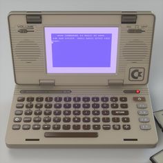 an old laptop computer with a purple screen