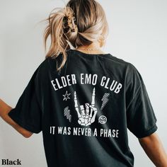 This trendy shirt is the perfect gift for the elder emo in your life. You know, the one that has never stopped loving those old pop punk hits and still goes to every reunion concert/festival they can find. Maybe you're the one that can't get enough of that nostalgic, bittersweet feeling. Gift yourself with this comfy shirt and go jam out. Each shirt is custom made at the time you order it. Please note: Colors may appear slightly different in-person due to computer/phone screens.  SIZE: ❤ This is Emo Gifts, Punk Rock Shirts, Cute Emo Outfits, Elder Emo, Scene Shirt, Emo Phase, Outfit Oversize, Punk Shirt, You're The One