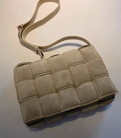 Bottega Veneta's offering under Daniel Lee, the Padded Cassette shoulder bag is destined to be a future favorite. As its name implies, this Italian-crafted style's made from soft, quilted leather with a playfully padded finish. Let its tapioca-yellow colorway complement soft-toned ensembles. Measurements: H x W x D 6.5” x 10.5” x 3” Country of Origin: Italy Send us an email for available colors. LNS@LuxuryNextSeason.com Bottega Veneta Padded Cassette Bag, Padded Cassette Bag, Handcrafted Handbags, Designer Leather Bags, Trendy Handbags, Genuine Leather Handbag, Best Bags, Fashion Icon, Small Purse