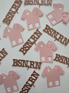 pink and gold glitter baby shower cutouts on white background with name in the middle