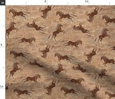 the fabric has horses on it in brown and tan colors, as well as numbers