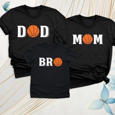 Basketball Family Matching Custom Shirt, Basketball Mom Dad Bro Tshirt, Basketball Mom Tee, Basketball Birthday Gift Tee, Sports Family Tee. These are clothes designed for parents who are interested in basketball and whose children or relatives play this sport. These t-shirts are often emblazoned with "basketball"-themed graphics, text and colors, helping parents express their pride in supporting their child's game or practice. It is designed to serve both comfort and a supportive role and is of Sporty Graphic Print T-shirt For Mother's Day, Father's Day Matching Black T-shirt, Sporty Black T-shirt For Father's Day, Black Sporty T-shirt For Father's Day, Black Tops With Letter Print For Family Matching, Black Team Spirit T-shirt For Father's Day, Sporty Crew Neck T-shirt For Mother's Day, Matching Black T-shirt With Letter Print, Black Matching T-shirt With Letter Print