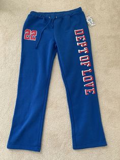 Blue Fleece Joggers For Loungewear, Blue Fleece Sweatpants For Winter, Blue Fleece Activewear For Loungewear, Blue Fleece Bottoms For Loungewear, Blue Winter Activewear For Leisure, Blue Fleece Joggers With Elastic Waistband, Casual Blue Winter Activewear, Blue Fleece Sweatpants With Elastic Waistband, Blue Winter Leisure Activewear