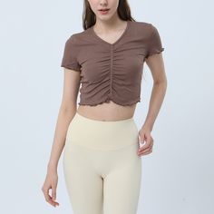 87% Viscose . 13% Spandex Soft. comfortable. skin friendly 4-way stretch. breathable and sweat-wicking Classic V-shape neckline Designed with ruched tailoring for a textured look Cropped designs that allow your skin to breathe all while being cute & trendy. Perfectly pair with your favorite pants. skirts. leggings. joggers. etc. Perfect for both sports activities and daily life Summer Ruched Activewear For Workout, Ruched Activewear For Summer Workouts, Stretch Athleisure Activewear With Ruched Sides, Athleisure Activewear With Ruched Sides And Stretch, Seamless Elastane Tops For Light Exercise, Solid Ruched Activewear For Yoga, Summer Ruched Athleisure Activewear, Ruched Summer Athleisure Activewear, Ruched Athleisure Activewear For Summer