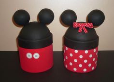 two mickey and minnie mouse containers on a table