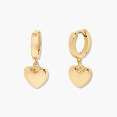 Love is in the air with these golden heart earrings. Showcase your sparkle and make a statement with these perfect pair of hearts – they'll bring the perfect hint of romance to any outfit. Available in 14k gold plated brass 1/2" huggie with 3/8" charm Hinge closure Protected with an anti-tarnish barrier SKU: BYE1165 Ruby Heart, Modern Jewellery Design, Golden Heart, Chic Earrings, Bold And Beautiful, Huggie Earrings, Love Is In The Air, Gold Plated Earrings, Huggies Earrings