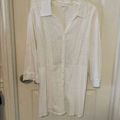 This White Blouse Has 3/4 Length Sleeves And A Button Front Closure. It Has Pintucking On The Bodice As Well As The Back. It Has A Tie That Can Be Placed In The Front Or The Back. It Is In Excellent Condition: Brand New! 3/4 Sleeve Blouse With Button Closure For Daywear, Velvet Tunic, Sequin Tee, Floral Tunic Tops, Plaid Tunic, Fitted Cardigan, Ultra Feminine, Dolman Sleeve Tops, Floral Tunic