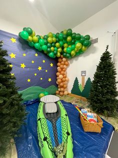 an inflatable boat with balloons and trees