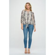 This three-quarter sleeve printed blouse is also one our favorite go-to items! It has a keyhole detail and a tie front knot at the waist. We love this look when paired back to denim as a perfect everyday top. It is lined for coverage. Imported. Material - 100% Polyester. Lining - 100% Polyester Machine washable. Printed 3/4 Sleeve Blouse For Fall, Printed 3/4 Sleeve Blouse, Fall Printed Tops With 3/4 Sleeves, Shipt Shopper, Tie Front Blouse, Hem Style, Fabric Names, Quarter Sleeve, Three Quarter Sleeves