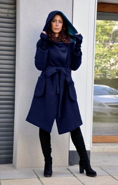 "Hooded Wool Coat, Winter Wool Coat, Dark Blue Coat Dark Blue coat. Autumn-winter loose coat. Wool hooded maxi coat. Oversize wool jacket. Handmade item. The coat has a viscose lining. Two pockets, warm hood. 100% wool, best quality wool coat . Casual and warm, cozy and very comfortable . You can wear it in winter in warmer days, and in autumn and winter. The coat goes with a belt. Model wearing size : SIZE S Color : dark blue SIZE S (US 6, UK 10, Italian 40, French 38, German 36, Japan 7) bust: Blue Wool Coat With Pockets For Fall, Blue Hooded Outerwear For Work, Long Peacoat With Pockets, Hooded Wool Coat With Pockets For Winter, Blue Winter Sweater Coat With Pockets, Blue Long Peacoat For Winter, Blue Pea Coat With Pockets For Winter, Long Peacoat With Pockets For Cold Weather, Long Solid Sweater Coat With Pockets