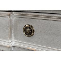 a close up of a drawer with a metal knob on the top and bottom part