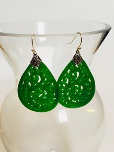 A pair of vintage green carved jade earrings comes with 925 sterling silver hooks. The big emerald-like green jade drops are heavy duty and being carved into full delicate tree/leaf details. The laced teardrop designs bring you a taste of ancient Chinese royal feel. Some highlights of this elegant and fancy dangle silver jade earrings are: *High-quality materials Quality green jade, delicate carving details, 925 sterling silver. Makes perfect gift for yourself or friends. *Vintage Chinese style Green Teardrop Pierced Earrings As A Gift, Green Pierced Drop Earrings, Elegant Handmade Green Teardrop Earrings, Green Teardrop Pierced Earrings For Gift, Green Ornate Jewelry, Ornate Green Earrings As Gift, Green Drop Earrings, Pierced, Green Teardrop Dangle Earrings, Ornate Green Pierced Jewelry