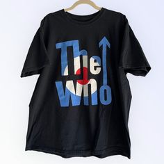 Relive the electrifying energy of The Who's 2019 tour with our official concert t-shirt, a cherished keepsake for fans of the iconic rock band. Featuring vibrant graphics and the tour dates emblazoned on the back, this shirt captures the essence of their legendary performances. Crafted with premium materials for comfort and durability, it's the perfect way to commemorate The Who's unforgettable live experience. Size: XLCondition: Pre-owned, laundered and cleanedAll retro inspired, vintage and pr Band Logo T-shirt For Music Festivals, Crew Neck, Band Logo T-shirt For Music Festivals With Crew Neck, Band Logo Crew Neck T-shirt For Music Festivals, Crew Neck T-shirt With Band Logo For Music Festivals, Pre-shrunk Black T-shirt For Music Festival, Alternative Style Crew Neck T-shirt For Music Festivals, Black Short Sleeve T-shirt For Music Festival, Black Cotton T-shirt For Music Festival, Band Merch T-shirt For Music Festival With Screen Print