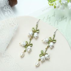 Lily Of The Valley Earrings are one of the best sellers among nature jewelry on Selenichast online shop. They are everyday earrings. This pair of pearl earrings are very popular as fine jewelry. Elegant Green Earrings For Mother's Day, Green Flower Earrings With Ear Wire For Wedding, Green Flower Earrings For Wedding With Ear Wire, Lily Of The Valley Jewelry, Jewelry For Wedding, Flowers Earrings, Good Wishes, Pearls Earrings, Simple Gift Wrapping