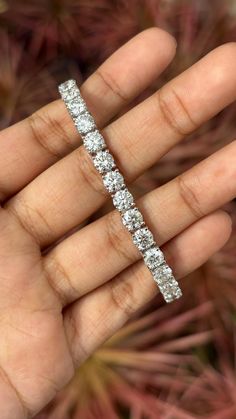 This is one of our most beloved and beautifully handcrafted lab diamond bracelet. This bracelet is studded with 17.30 carat Lab Diamonds that are round-cut. The bracelet is set in 15.69 grams 18K White Gold. The lab-grown diamonds used in this bracelet are created using advanced Chemical Vapor Deposition (CVD) technology, a process we proudly specialize in. These diamonds possess the same physical, chemical, and optical properties as diamonds, ensuring they sparkle with unparalleled brilliance a Luxury Diamond Tennis Bracelet For Wedding, Luxury Round Platinum Diamond Bracelet, Luxury Diamond White Bracelet With Prong Setting, Luxury Diamond White Diamond Bracelet For Anniversary, Platinum Tennis Bracelet With Single Cut Diamonds, Platinum Diamond Cut Bracelet In Diamond White, Brilliant Cut Moissanite Bracelet Jewelry, Platinum Bracelets With Diamond Accents Round Cut, Luxury Diamond White Bracelet For Anniversary