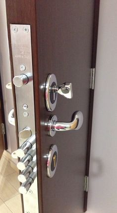 the door is open and there are many knobs on it