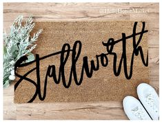 a welcome mat with the word'staffworth'written in cursive font