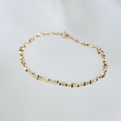 Dainty 14k Gold Jubilee Chain Bracelet, Delicate Gold Plated Bracelet With Chain, Delicate 14k Gold Bracelets With Adjustable Chain, Delicate 14k Gold-filled Yellow Gold Bracelets, Delicate 14k Yellow Gold Filled Bracelets, Delicate 14k Gold Bracelet With Delicate Chain, Elegant 14k Gold-filled Yellow Gold Chain Bracelet, Elegant 14k Gold-filled Bracelet, Dainty 14k Gold Filled Bracelet