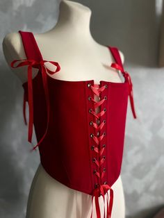 Immerse yourself in the exquisite world of corsetry with our unique offering: corset making featuring double lacing and personalized fabric selection. Our skilled artisans meticulously craft each corset, combining the elegance of double lacing with your chosen fabric print. Whether you envision a floral fantasy, a whimsical pattern, or a sleek minimalist design, we offer a diverse range of fabrics to bring your vision to life. If you want a corset in a different color, write to me If you don't s Red Fitted Corset With Boning, Red Corset With Boning, Red Fitted Corset With Built-in Bra, Red Corset With Built-in Bra, Red Corset Top, Corset Plus Size, Steampunk Red Overbust Corset, Handmade Corset, Corset Making