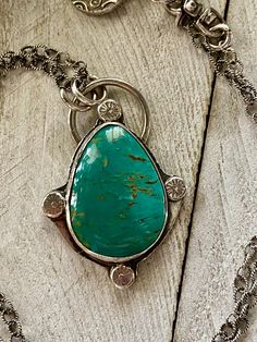 Patagonia turquoise from Arizona is this deep color of green in a teardrop shape set in sterling silver. It hangs from a textured sterling silver oxidized chain with a small fine silver charm finishing it off with sterling silver findings. The chain is 18 inches in length with the pendant adding another 1 3/4 inches.  For more artisan jewelry you can re enter my shop here:  https://www.etsy.com/shop/DianesAddiction?ref=si_shop Thanks for visiting my shop. Bohemian Teardrop Large Stone Jewelry, Bohemian Teardrop Jewelry With Large Stone, Bohemian Teardrop Large Stone Necklace, Southwestern Teardrop Gemstone Jewelry, Southwestern Style Teardrop Gemstone Jewelry, Artisan Turquoise Teardrop Pendant Necklace, Bohemian Turquoise Teardrop Pendant Necklace, Handmade Bohemian Teardrop Turquoise Necklace, Blue Turquoise Necklace With Large Teardrop Stone