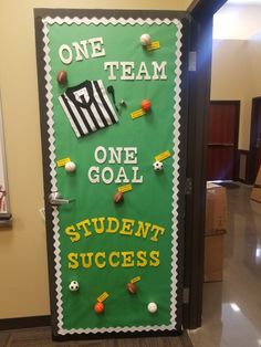 a door decorated with sports related items and the words team one goal, student success