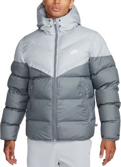 Fit & Design: Relaxed fit puffer jacket Gives you room to layer up underneath for those extra chilly days Designed to feel relaxed through the chest and body Smooth taffeta lining provides added warmth Zippered side pockets offer storage for the essentials 2-way front zipper lets you customize your fit Elastic cuffs and hem provide a more comfortable fit Technology: Nike® Storm-FIT technology resists elements like wind and water to help keep you comfortable in harsh weather conditions PrimaLoft Thermoplume insulation offers a premium alternative to down that doesn't sacrifice on heat retention Water-repellent and windproof woven fabric, with color blocking on select colorways Nike Windrunner, Puffer Jacket Men, Hooded Puffer Jacket, Puffy Jacket, Athletic Apparel, Sports Gear, Puffer Jacket, Outerwear Jackets, Nike Jacket