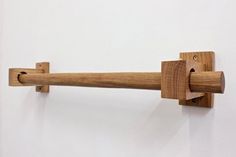 a wooden handle on a white wall