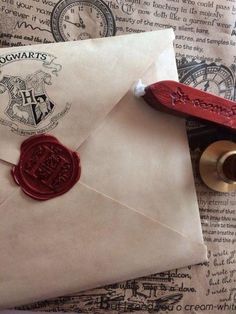 an envelope with a wax stamp on it